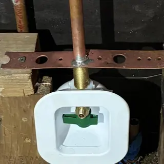 Ice maker water supply valve reroute in wall