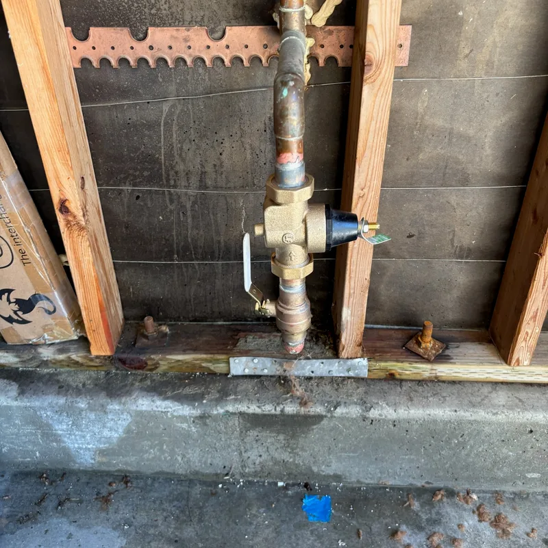One-inch pressure regulator and ball valve installed on copper pipe