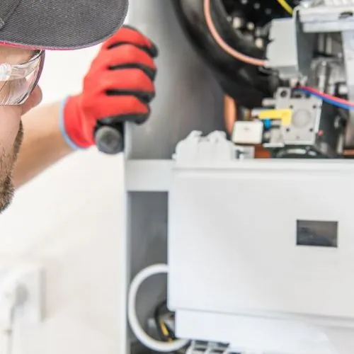 Technician checks furnace.