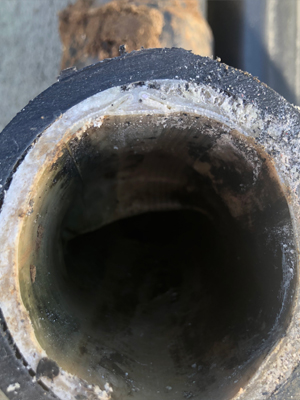Clean cut of main line sewer repair by Family Plumbing, Heating & Air, Inc.